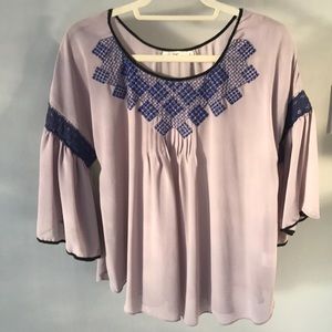 Top with embroidery and 3/4 bell sleeves.